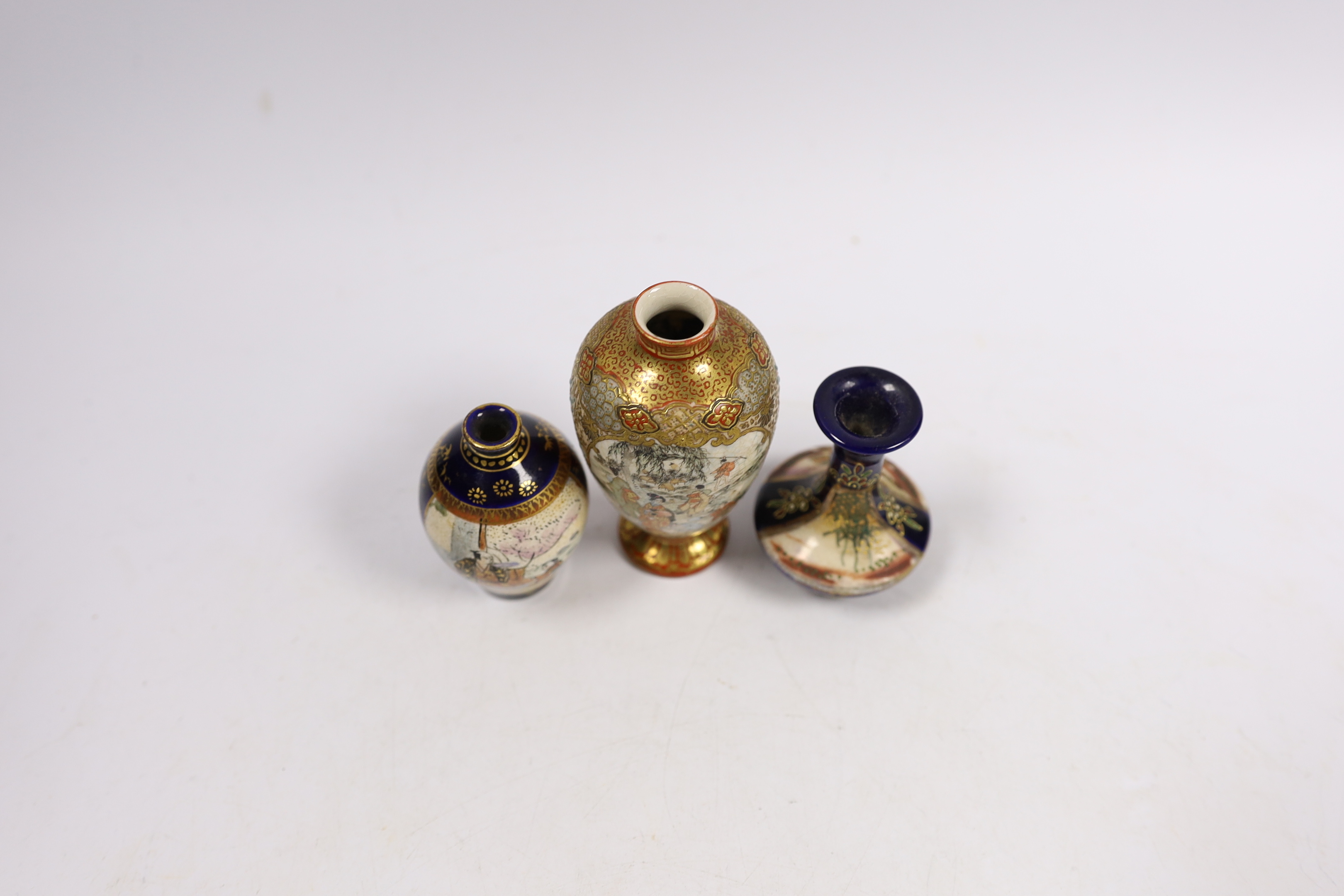 A Japanese miniature Kutani vase and two Satsuma examples, largest 9cm high